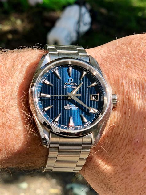 omega aqua terra on wrist.